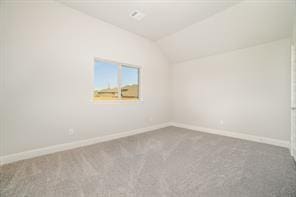 609 Alaina Dr, Desoto, TX 75115 - empty room with lofted ceiling, carpet, and baseboards