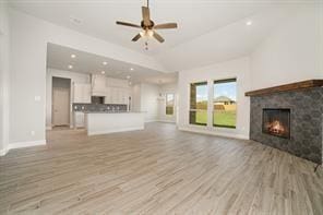 609 Alaina Dr, Desoto, TX 75115 - unfurnished living room featuring a ceiling fan, a fireplace, light wood-type flooring, baseboards, and recessed lighting