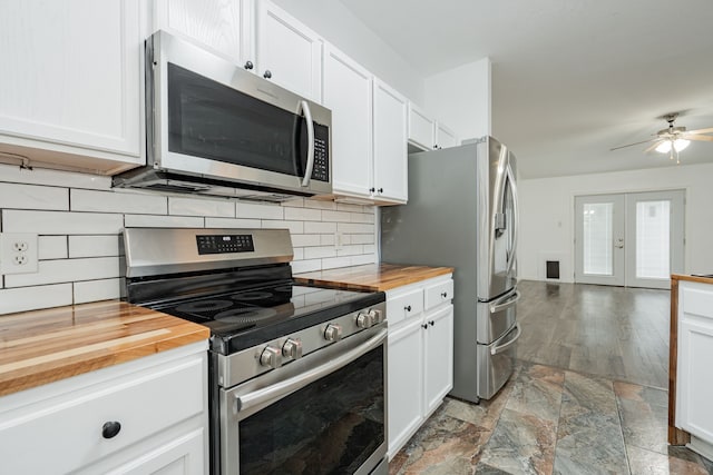 108 Freedom Trl, Forney, TX 75126 - kitchen featuring white cabinets, stainless steel appliances, butcher block countertops, and tasteful backsplash