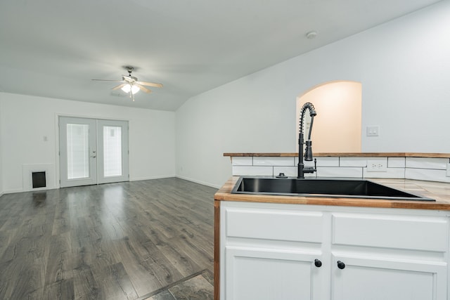 108 Freedom Trl, Forney, TX 75126 - kitchen featuring a sink, dark wood-style flooring, white cabinetry, arched walkways, and a ceiling fan