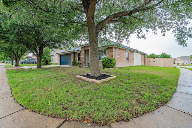 108 Freedom Trl, Forney, TX 75126 - view of front of property with fence, an attached garage, brick siding, driveway, and a front lawn