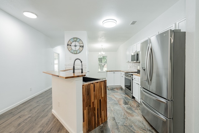 108 Freedom Trl, Forney, TX 75126 - kitchen with stainless steel appliances, wood counters, visible vents, backsplash, and white cabinets