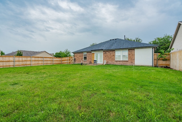 108 Freedom Trl, Forney, TX 75126 - rear view of house with brick siding, a lawn, and a fenced backyard