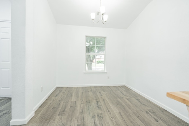 108 Freedom Trl, Forney, TX 75126 - spare room with baseboards, a chandelier, and wood finished floors