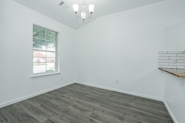 108 Freedom Trl, Forney, TX 75126 - empty room with baseboards, visible vents, vaulted ceiling, dark wood-style flooring, and a notable chandelier