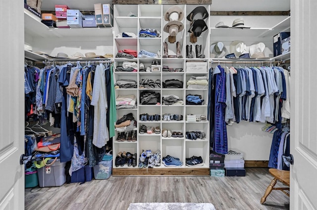 650 Scoggins Rd, Tioga, TX 76271 - walk in closet with wood finished floors