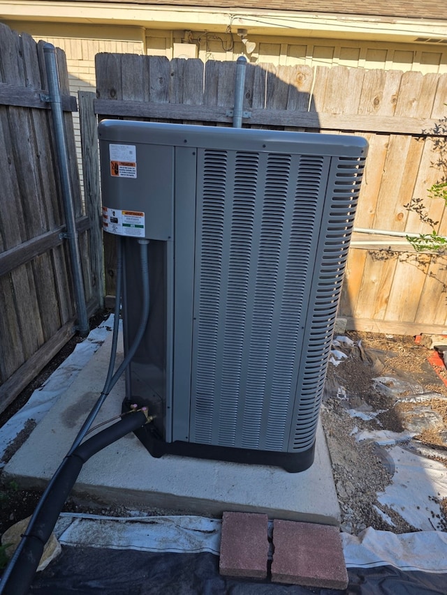 1608 University Dr, Richardson, TX 75081 - exterior view of central AC unit and fence