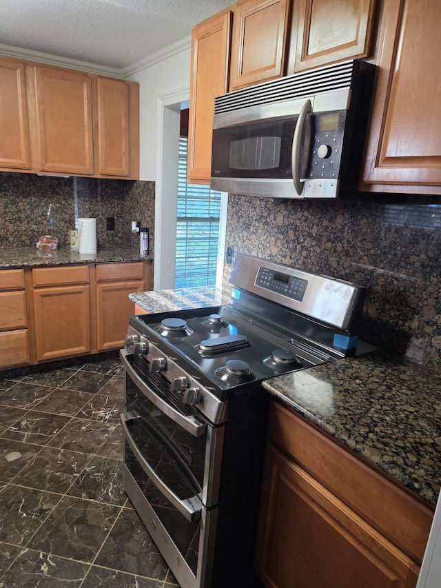 1608 University Dr, Richardson, TX 75081 - kitchen with stainless steel appliances, dark marble finish flooring, tasteful backsplash, dark stone countertops, and a textured ceiling