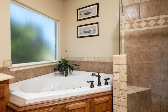 bathroom featuring a tub with jets