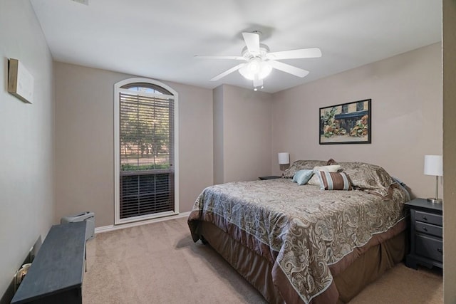 425 County Road 32230, Sumner, TX 75486 - bedroom with light carpet, a ceiling fan, and baseboards