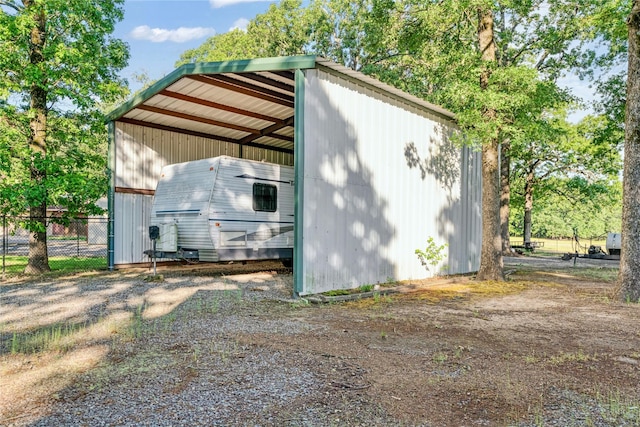 425 County Road 32230, Sumner, TX 75486 - view of pole building with fence and a carport