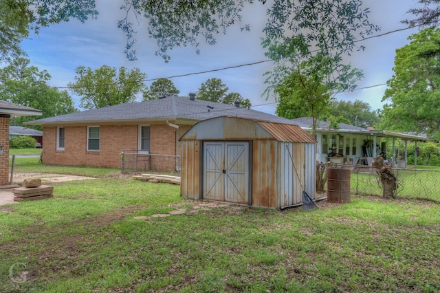 view of shed featuring fence