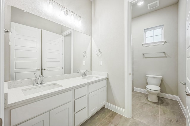 880 Brookwood Blvd, Haslet, TX 76052 - full bath with toilet, double vanity, and baseboards