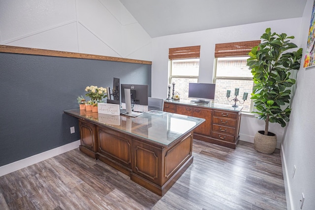 1025 N Churchill Dr, Fate, TX 75189 - home office featuring dark wood-style flooring, lofted ceiling, and baseboards