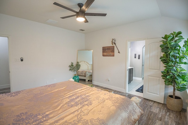 1025 N Churchill Dr, Fate, TX 75189 - unfurnished bedroom with wood finished floors, baseboards, vaulted ceiling, ceiling fan, and connected bathroom