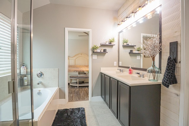1025 N Churchill Dr, Fate, TX 75189 - ensuite bathroom with a garden tub, tile patterned floors, double vanity, lofted ceiling, and an enclosed shower