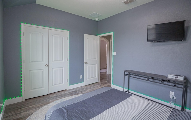1025 N Churchill Dr, Fate, TX 75189 - bedroom featuring wood finished floors, baseboards, and a closet