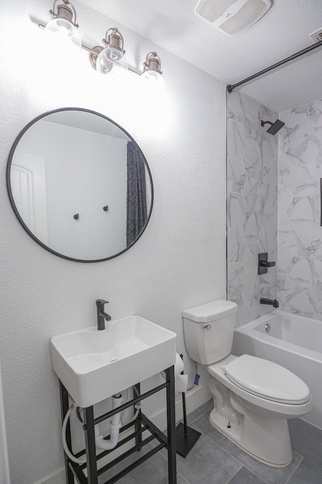 1025 N Churchill Dr, Fate, TX 75189 - full bathroom featuring toilet, shower / tub combination, tile patterned flooring, and baseboards