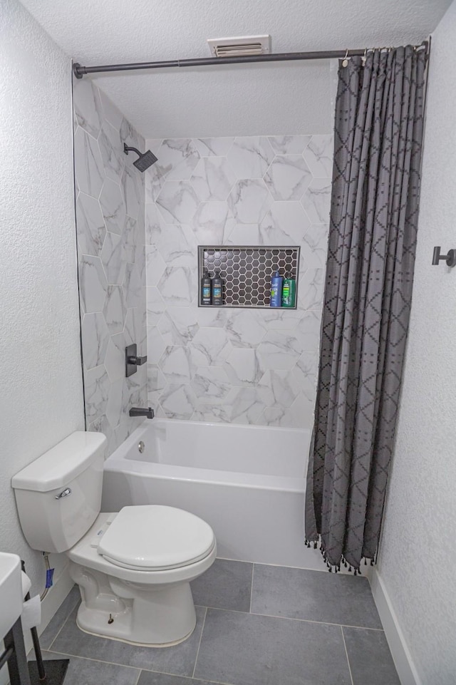1025 N Churchill Dr, Fate, TX 75189 - full bathroom featuring tile patterned flooring, shower / bath combo with shower curtain, toilet, baseboards, and a textured wall