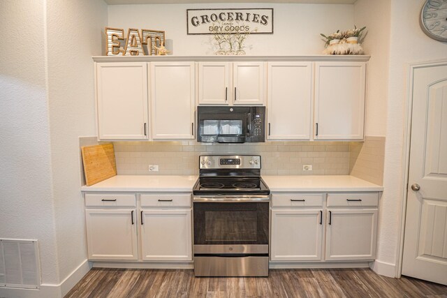 1025 N Churchill Dr, Fate, TX 75189 - kitchen featuring black microwave, stainless steel electric range, dark wood-style floors, decorative backsplash, and light countertops