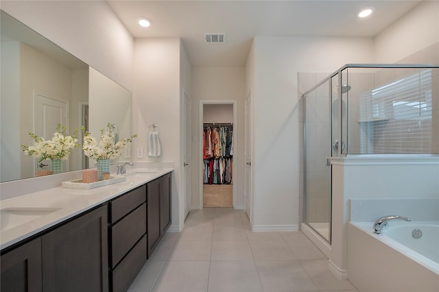10337 Geode St, Aubrey, TX 76227 - bathroom with a shower stall, baseboards, a bath, a spacious closet, and recessed lighting