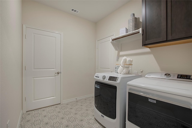 10337 Geode St, Aubrey, TX 76227 - clothes washing area with washing machine and clothes dryer, cabinet space, and baseboards
