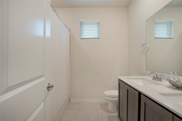 10337 Geode St, Aubrey, TX 76227 - bathroom featuring toilet, baseboards, a sink, tile patterned flooring, and double vanity