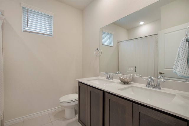 10337 Geode St, Aubrey, TX 76227 - bathroom featuring double vanity, toilet, tile patterned flooring, and a sink