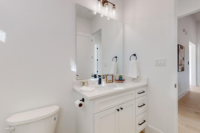 3791 Evergreen Ln, Caddo Mills, TX 75135 - half bath featuring toilet, wood finished floors, and vanity