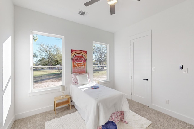 3791 Evergreen Ln, Caddo Mills, TX 75135 - bedroom with light carpet, baseboards, a ceiling fan, and visible vents