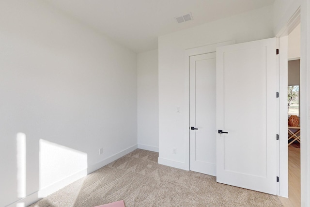 3791 Evergreen Ln, Caddo Mills, TX 75135 - unfurnished bedroom with light colored carpet, baseboards, and visible vents