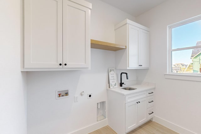 3791 Evergreen Ln, Caddo Mills, TX 75135 - washroom with baseboards, hookup for a washing machine, a sink, cabinet space, and electric dryer hookup