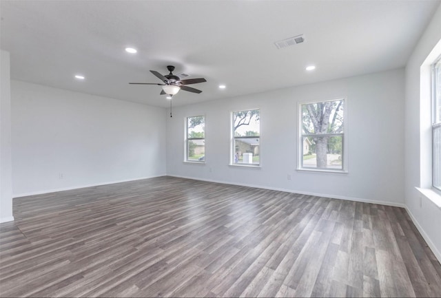 337 Travis Ln, Hewitt, TX 76643 - unfurnished room with dark wood finished floors, visible vents, baseboards, ceiling fan, and recessed lighting