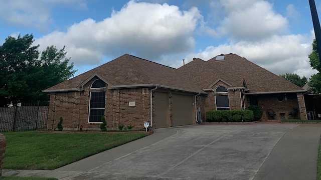 6001 Rock Cv, Flower Mound, TX 75028 - ranch-style house with brick siding, a garage, concrete driveway, and a shingled roof