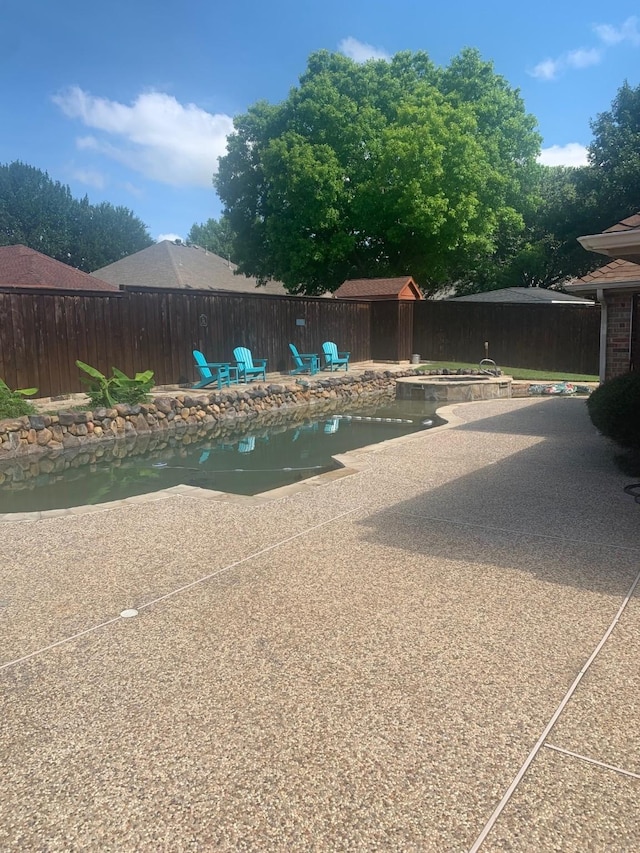 6001 Rock Cv, Flower Mound, TX 75028 - view of pool featuring a patio area and a fenced backyard