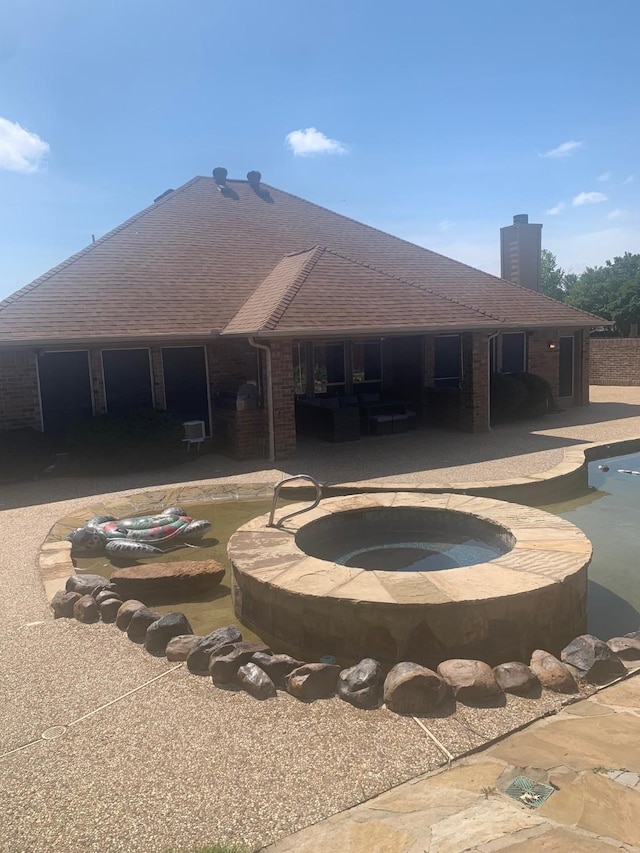 6001 Rock Cv, Flower Mound, TX 75028 - view of pool with a patio area and a pool with connected hot tub