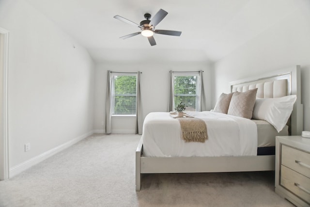 carpeted bedroom with baseboards and a ceiling fan