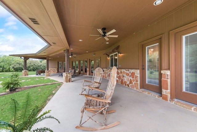 view of patio featuring visible vents, french doors, and a ceiling fan
