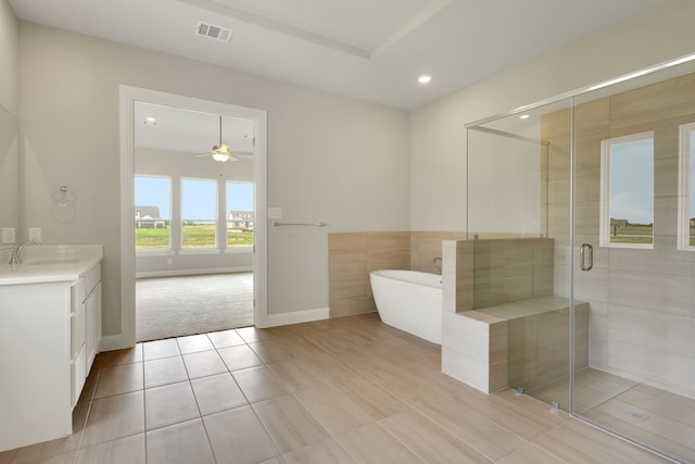 5614 Gaelic Dr, Celina, TX 75009 - bathroom with vanity, a soaking tub, recessed lighting, a shower stall, and tile patterned floors