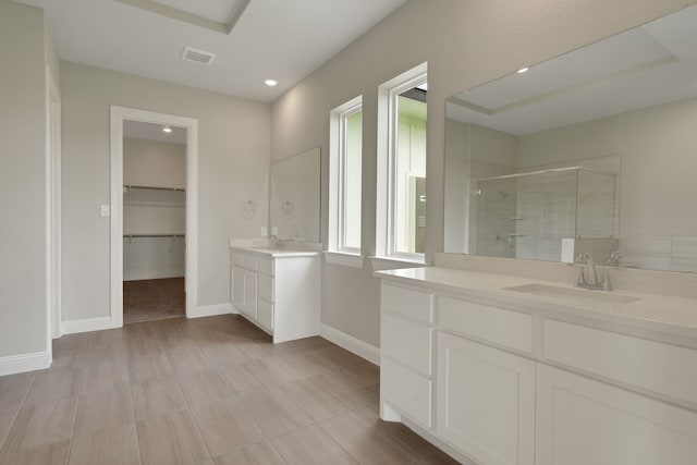 5614 Gaelic Dr, Celina, TX 75009 - full bath with a shower stall, two vanities, recessed lighting, and a spacious closet