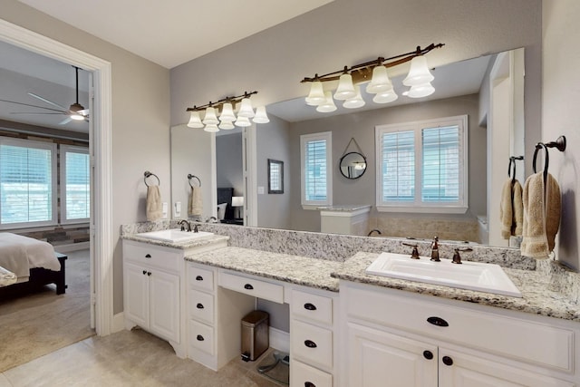 6404 Spring Wagon Dr, Mckinney, TX 75071 - ensuite bathroom with ceiling fan, healthy amount of natural light, double vanity, and tile patterned floors