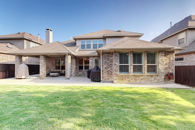 6404 Spring Wagon Dr, Mckinney, TX 75071 - rear view of house with a patio area, brick siding, an outdoor living space, and a shingled roof