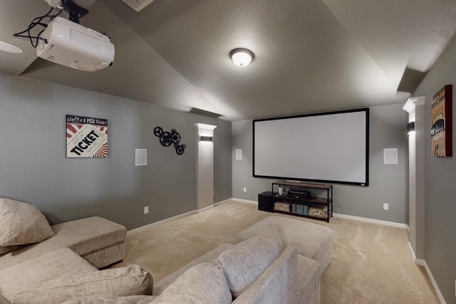 6404 Spring Wagon Dr, Mckinney, TX 75071 - cinema room with light colored carpet, lofted ceiling, and baseboards