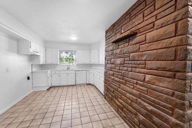 2349 Cooke St, Abilene, TX 79605 - kitchen featuring white dishwasher, a sink, light countertops, and decorative backsplash
