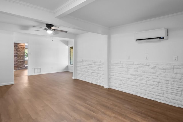 2349 Cooke St, Abilene, TX 79605 - unfurnished living room featuring a wall unit AC, ceiling fan, wood finished floors, baseboards, and ornamental molding