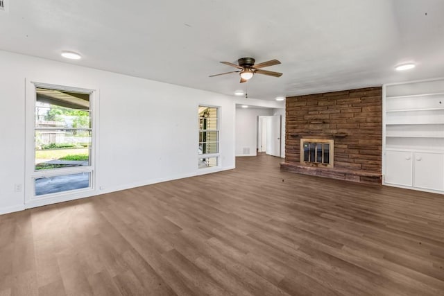 2349 Cooke St, Abilene, TX 79605 - unfurnished living room featuring ceiling fan, wood finished floors, a large fireplace, baseboards, and recessed lighting