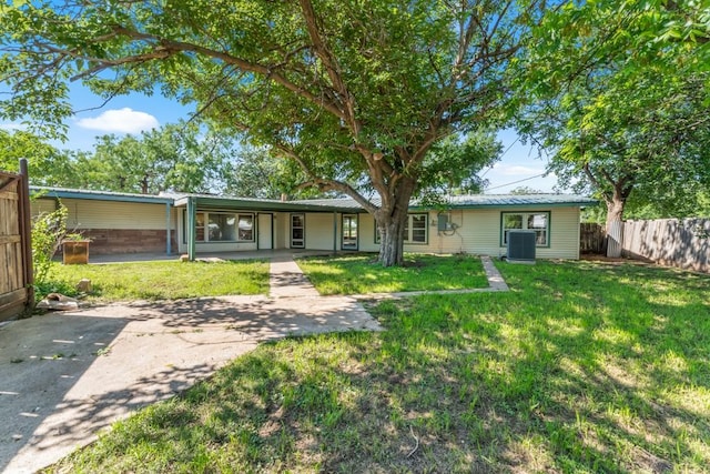 2349 Cooke St, Abilene, TX 79605 - back of property with central air condition unit and metal roof