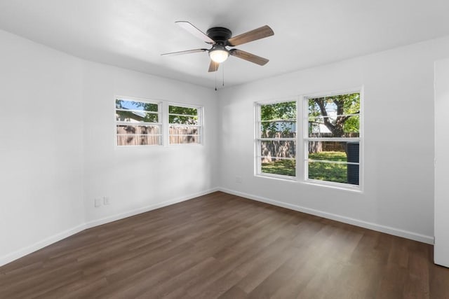 2349 Cooke St, Abilene, TX 79605 - spare room featuring dark wood-type flooring, baseboards, and ceiling fan