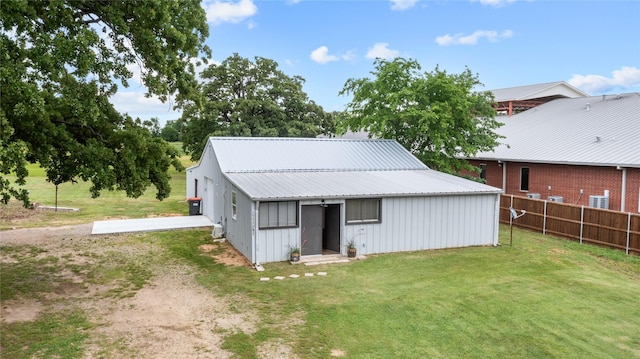 2230 Farm Road 79, Paris, TX 75460 - view of pole building with a lawn, driveway, and fence