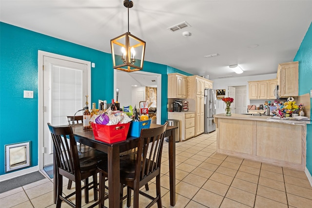 101 Remington Trl, Longview, TX 75604 - dining area featuring a chandelier, light tile patterned floors, and visible vents